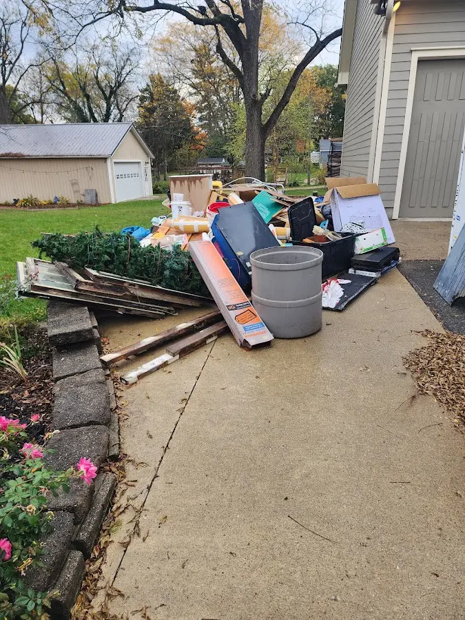 Dumpster being loaded with debris for Estate Cleanout Dumpster Rental in Oronoko